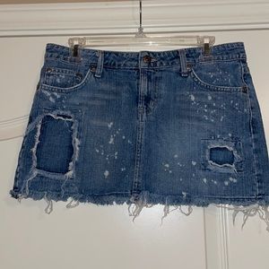 Distressed denim mini skirt